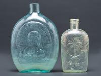 A Washington-Taylor Portrait Flask and South Carolina Dispensary Flask