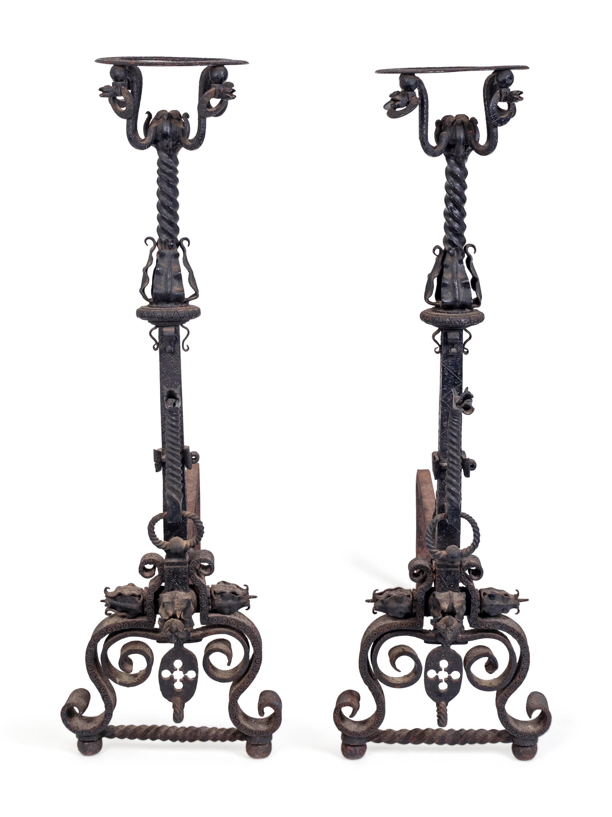 A Pair of Renaissance Style Wrought-Iron Andirons — IN THE MANNER OF SAMUEL YELLIN, EARLY 20TH CENTURY