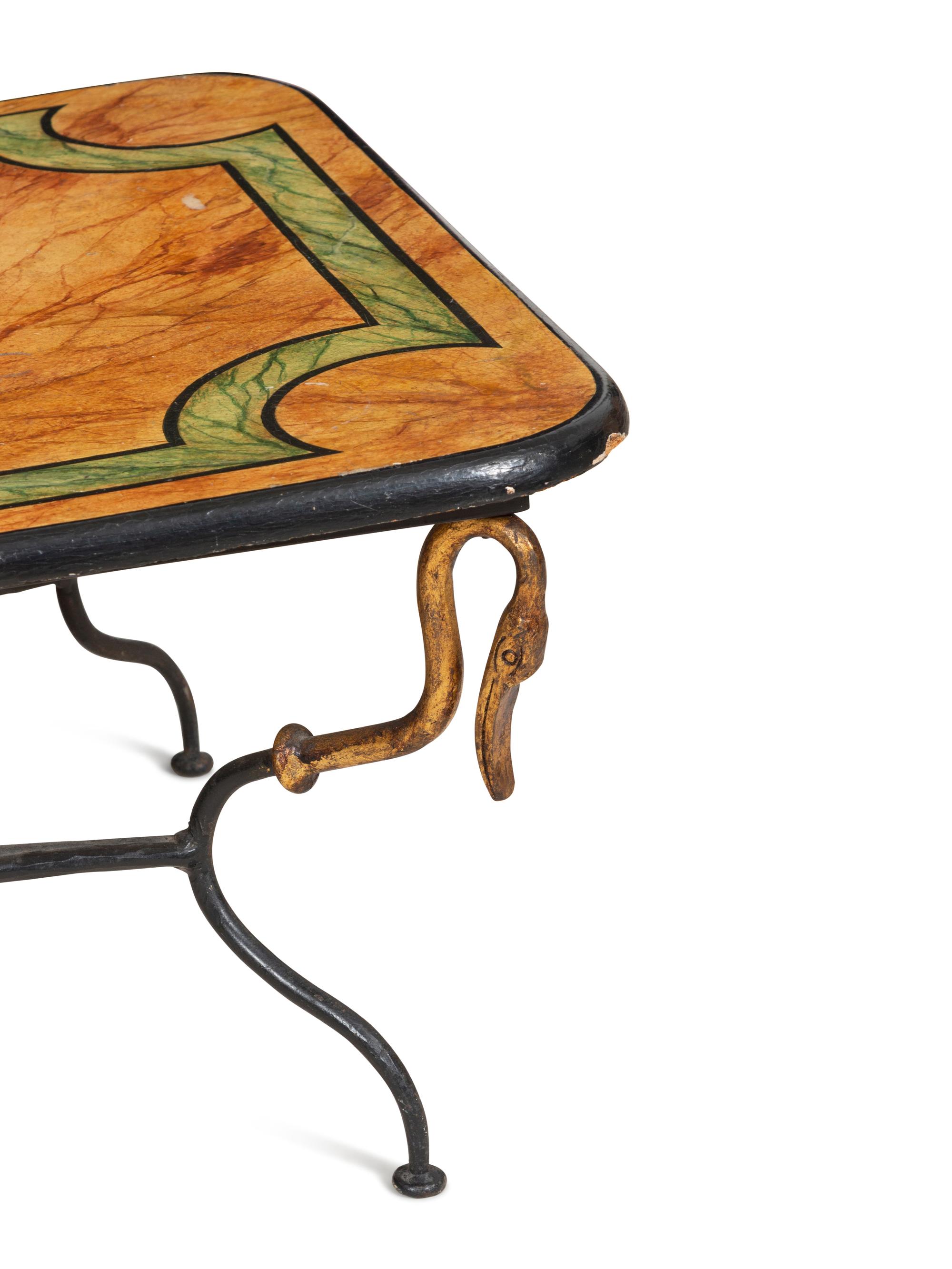 A Wrought Iron and Faux Marble Coffee Table