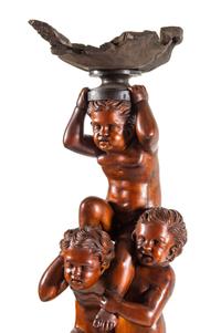 A Pair of Monumental Venetian Baroque Style Carved Walnut Torchères