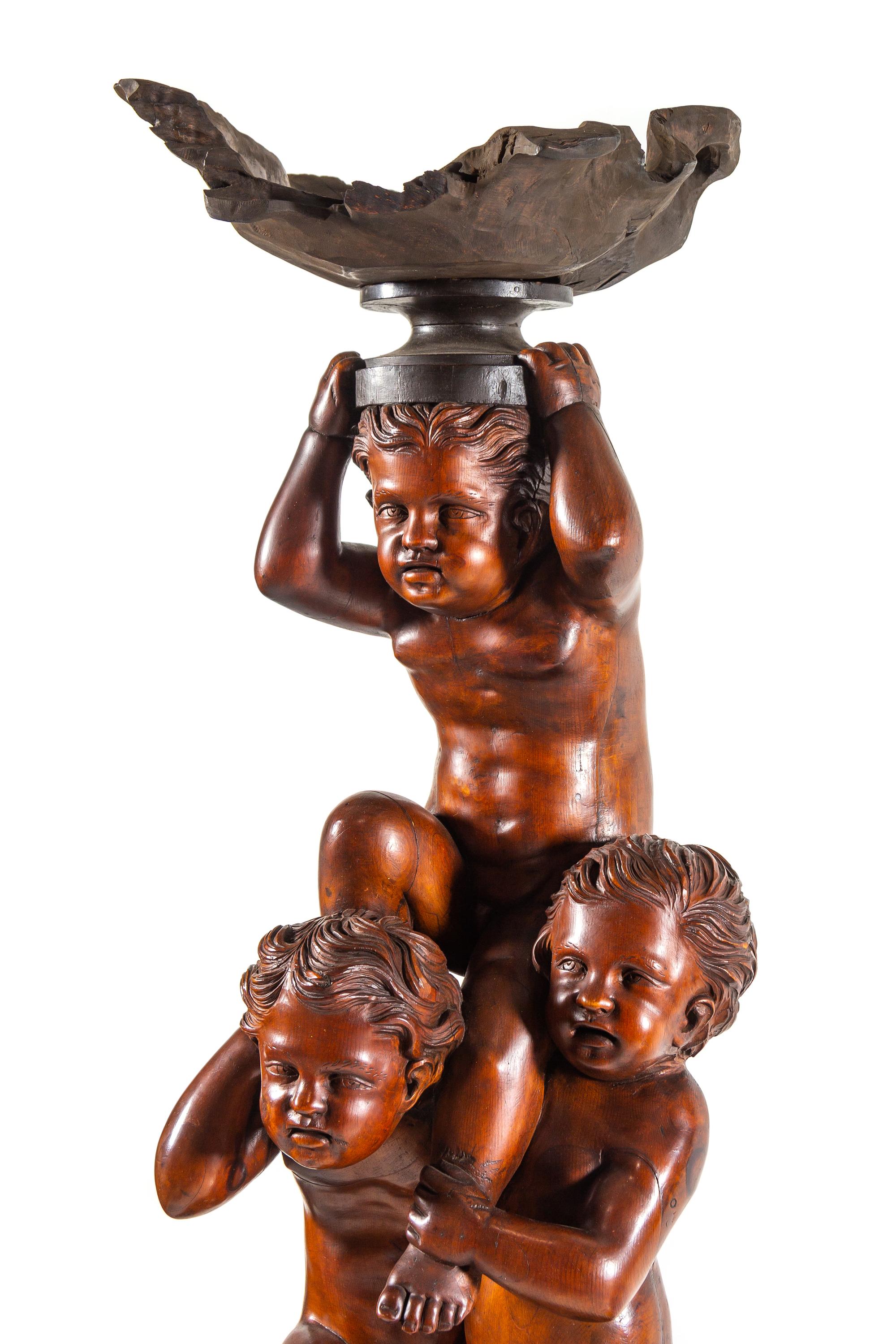 A Pair of Monumental Venetian Baroque Style Carved Walnut Torchères