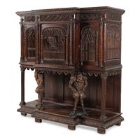 A Gothic Revival Carved Oak Court Cupboard