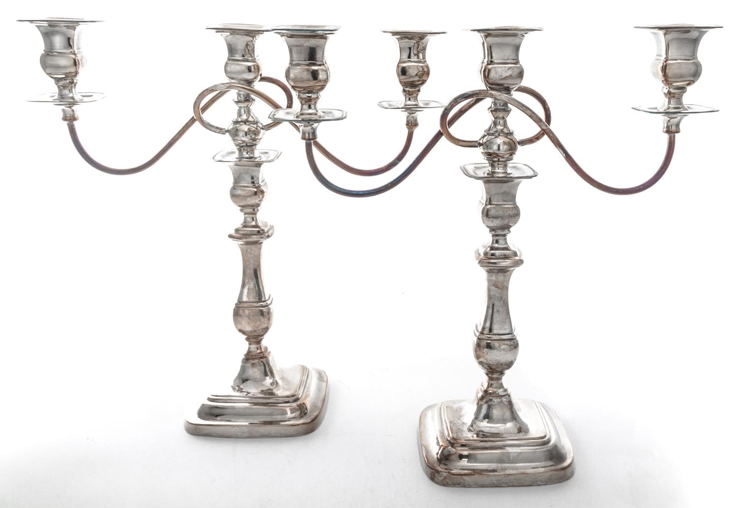 A Pair of English Silver-plate Three-Light Candelabra, , the baluster form stems supporting two scrolling branches.