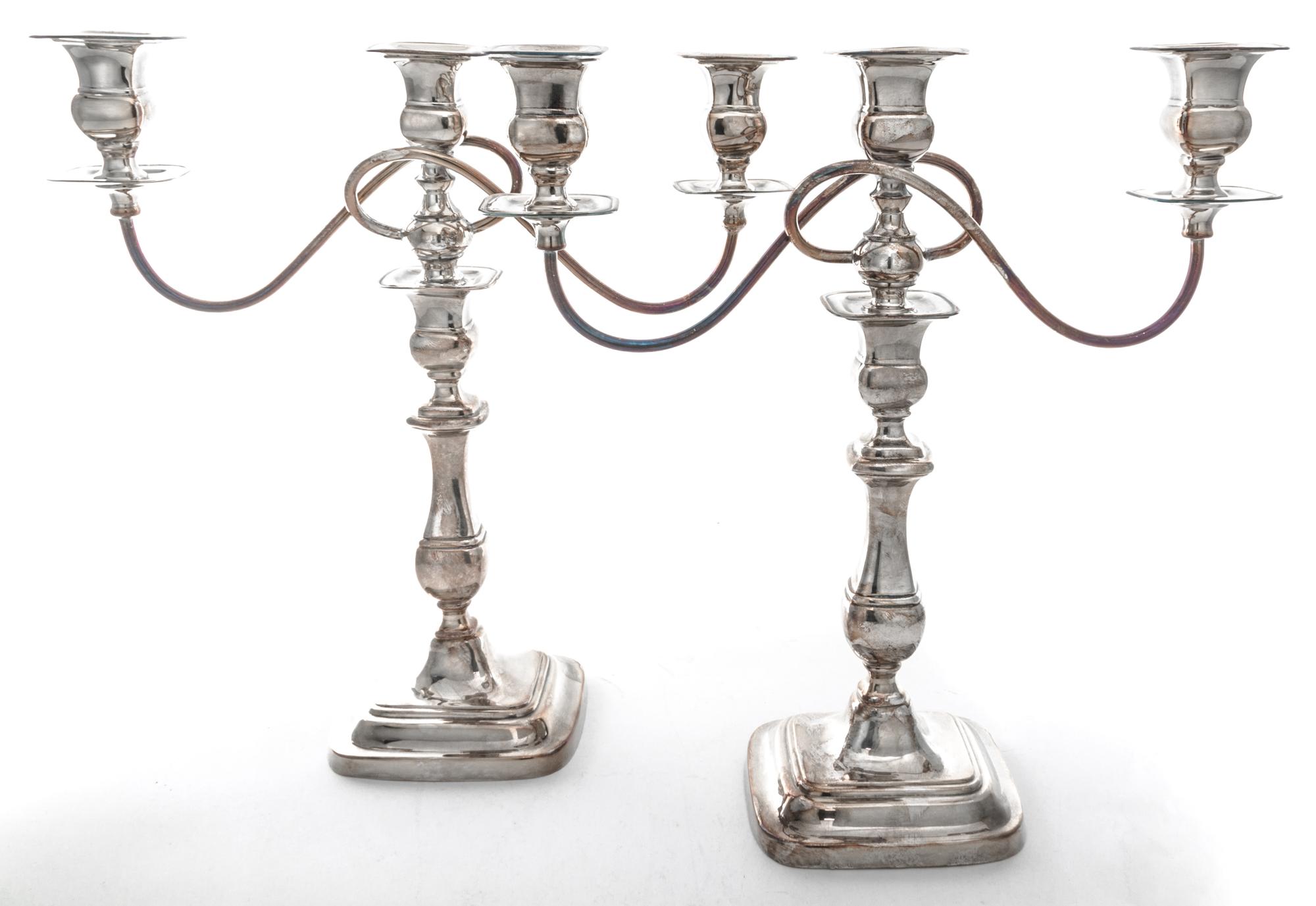 A Pair of English Silver-plate Three-Light Candelabra, , the baluster form stems supporting two scrolling branches.