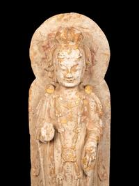 A Chinese Carved Stone Standing Buddha with Remnants of Gilt on Lotus-Form Base
