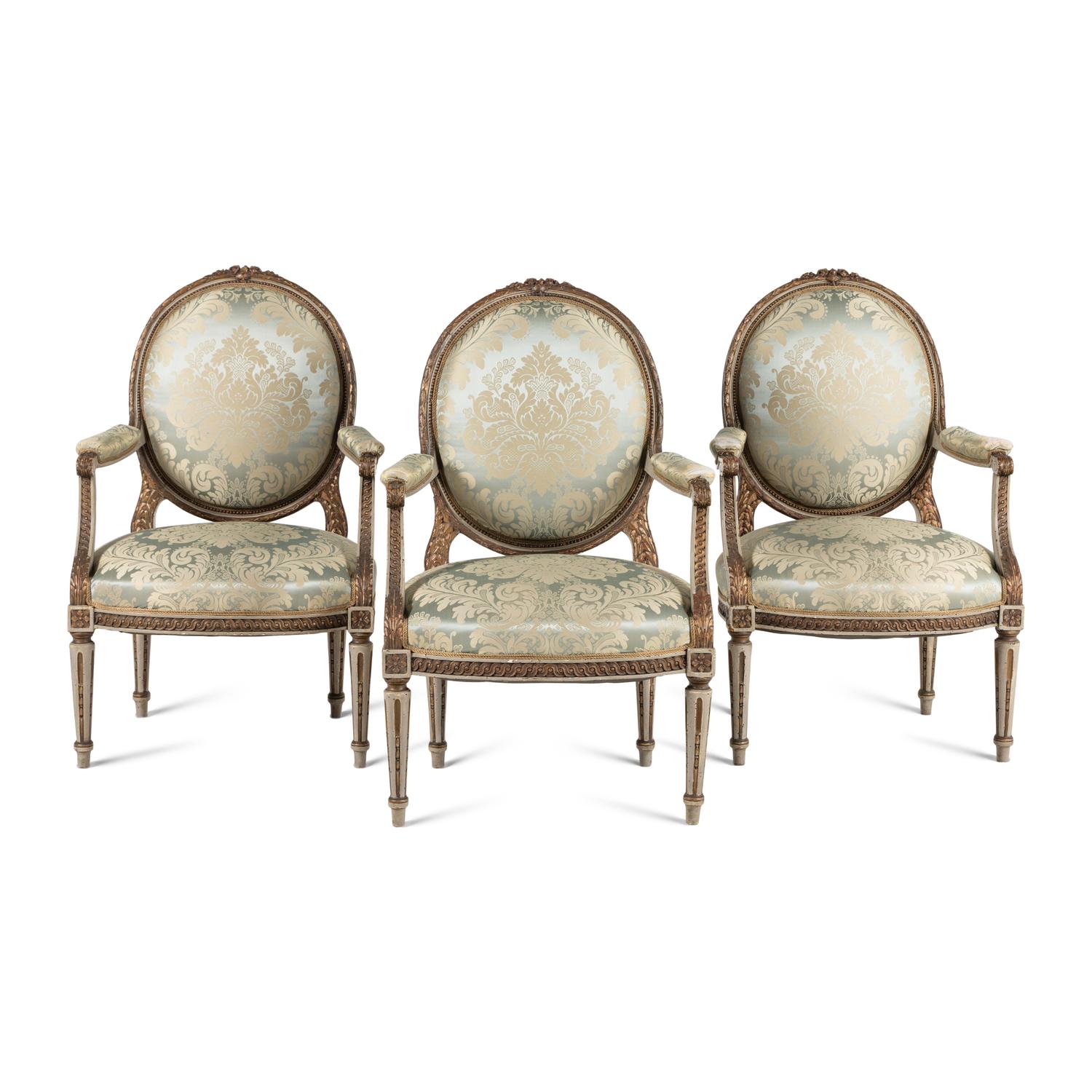 A Set Three of Louis XVI Style Grey-Painted and Parcel Gilt Fauteuils