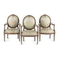 A Set Three of Louis XVI Style Grey-Painted and Parcel Gilt Fauteuils