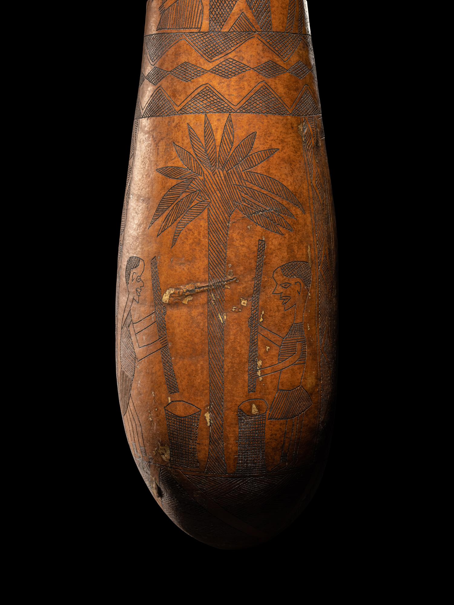 A Maasai Painted Hide Shield and Milk Gourd