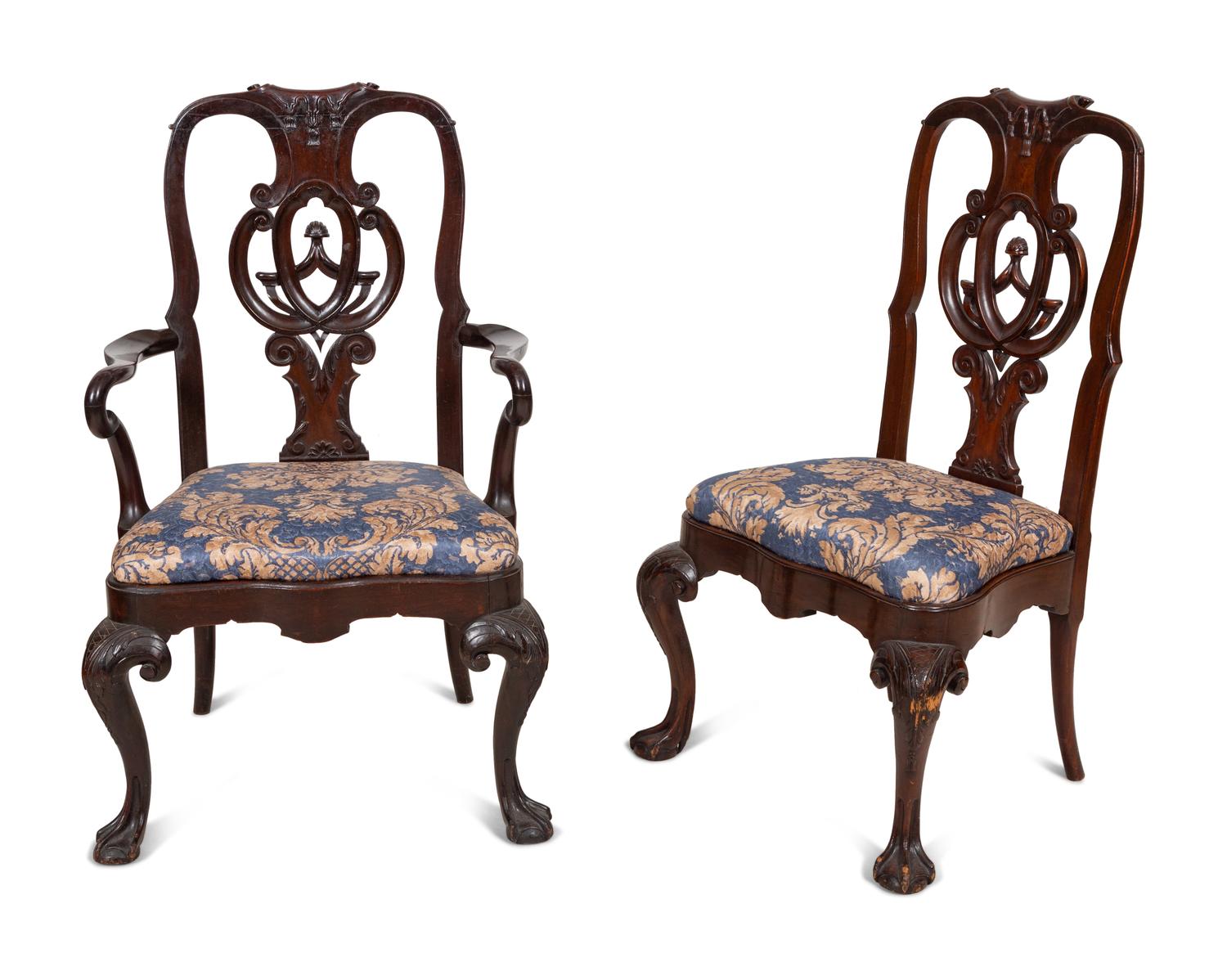 A Set of Twelve Continental Walnut Dining Chairs