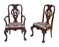 A Set of Twelve Continental Walnut Dining Chairs