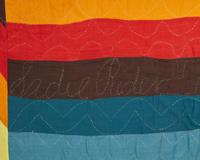A Mennonite "Jacob's Coat" Cotton Quilt, Signed "Sadie Rader," 20th Century