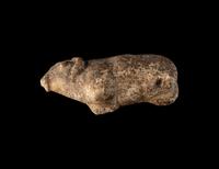 A Near Eastern Marble Figure of a Pregnant Mouflon