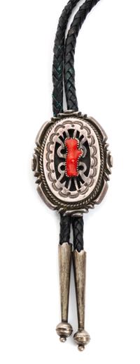 A Navajo Silver and Coral Bolo, Wilson Begay Height 2 1/2 x 1 3/4 inches.