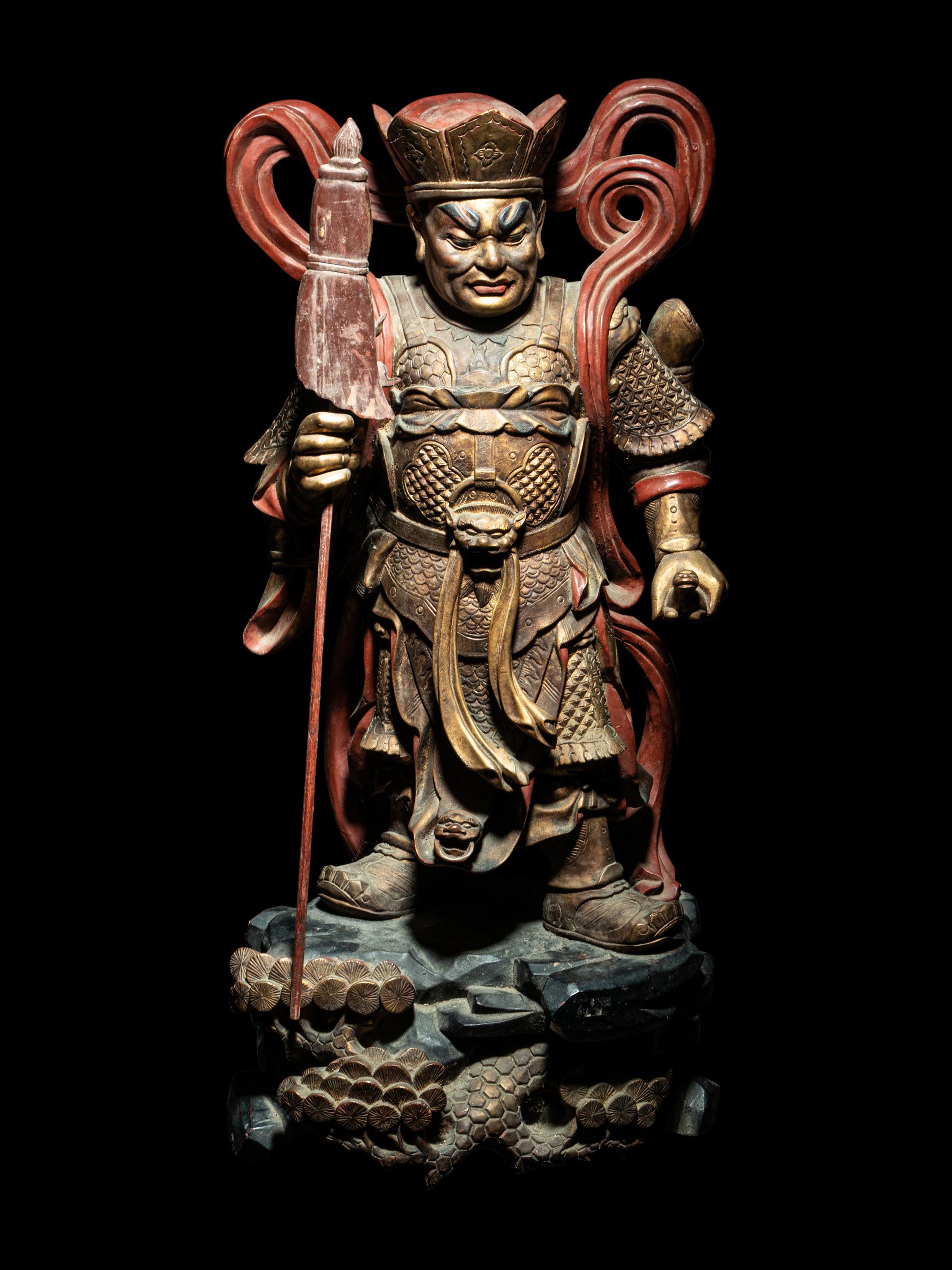 A Set of Four Gilt and Red Lacquered Wood Figures of Guardians
