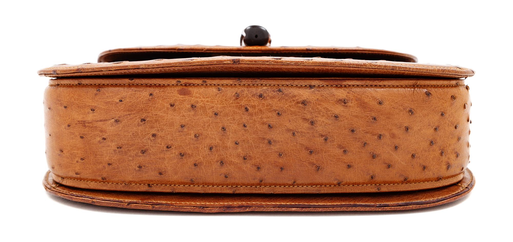 A Gucci Brown Ostrich Bamboo Top Handle Handbag, 7" H x 10.5" W x 2.5" D; Handle drop: 4.5".