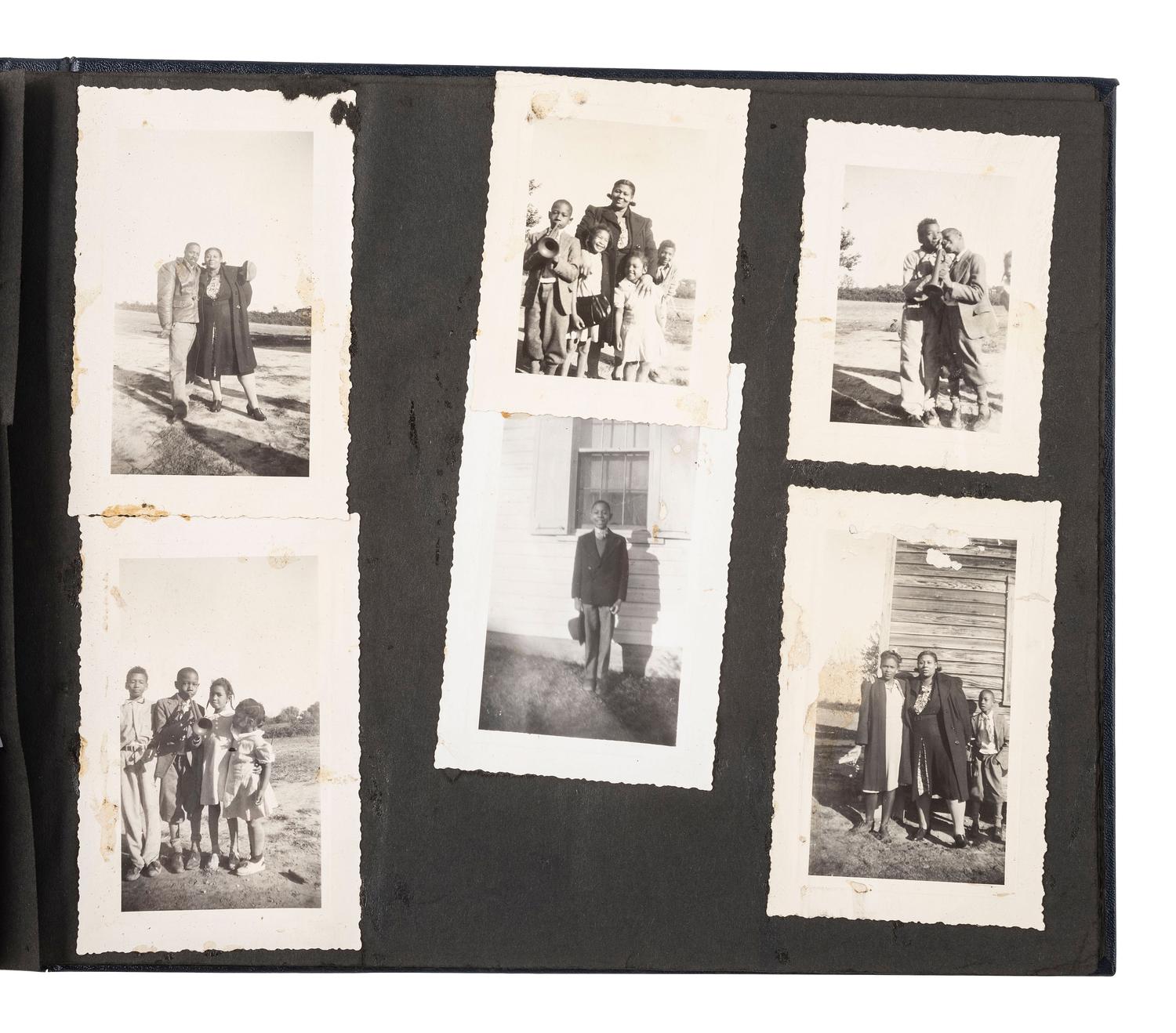 [EARLY PHOTOGRAPHY]. Album containing photos of a multi-generational African American family in Washington, DC. Ca early-to-mid 20th Century.