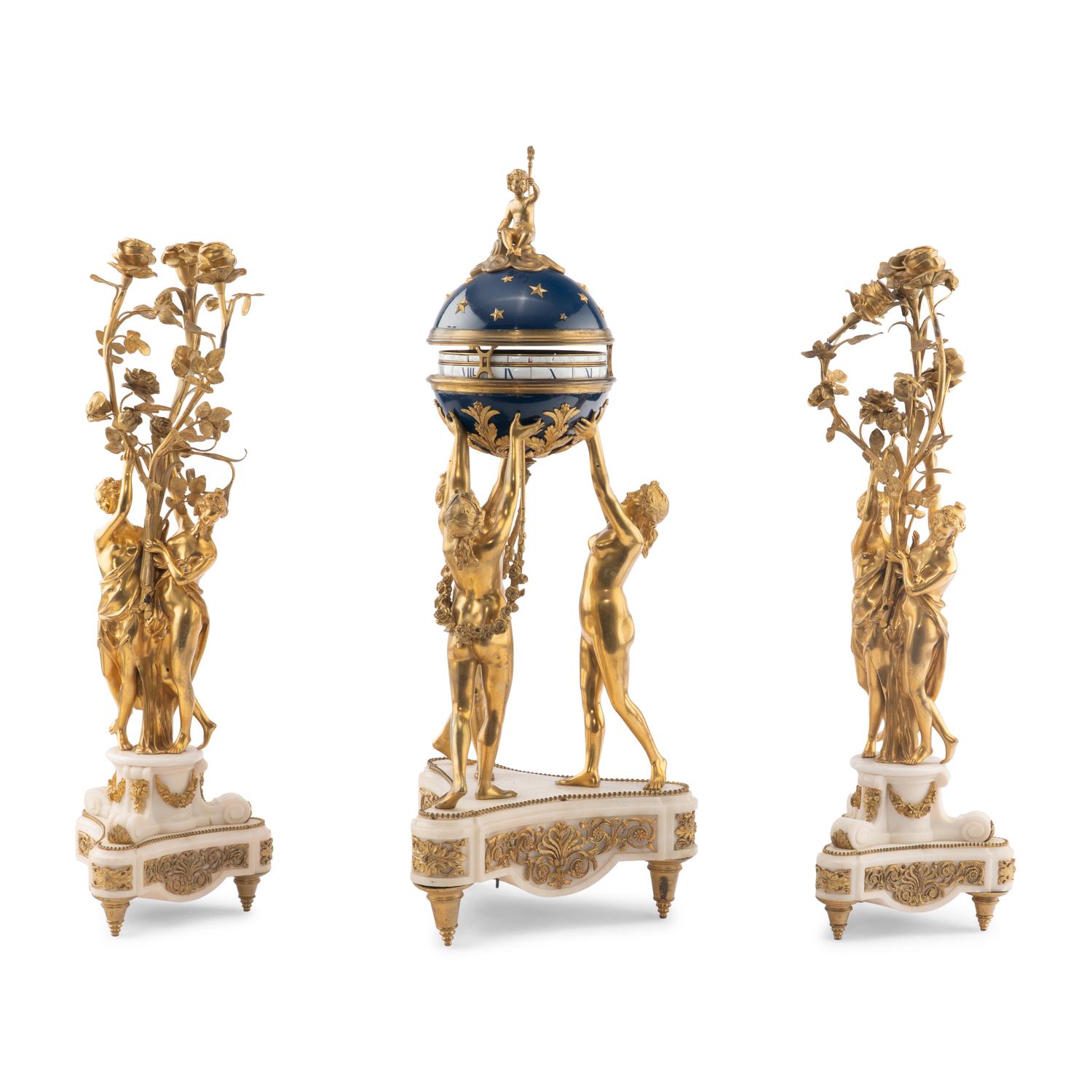 A Louis XVI Style Gilt-Bronze and White Marble Annular Clock Garniture