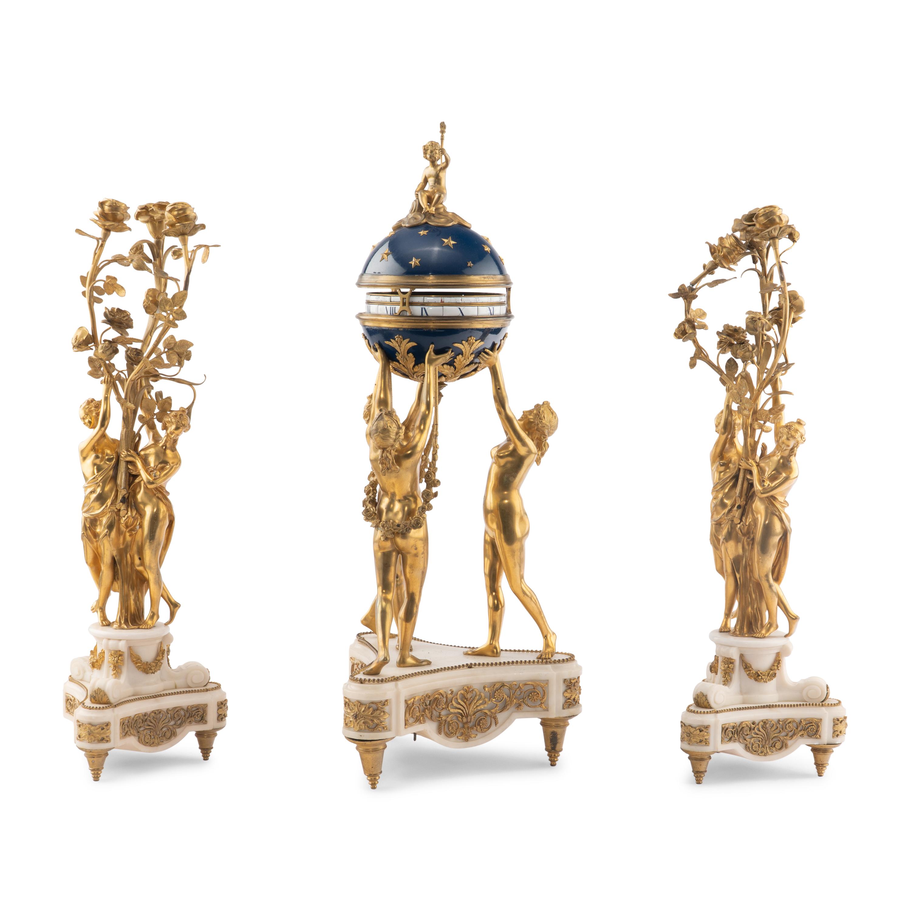A Louis XVI Style Gilt-Bronze and White Marble Annular Clock Garniture