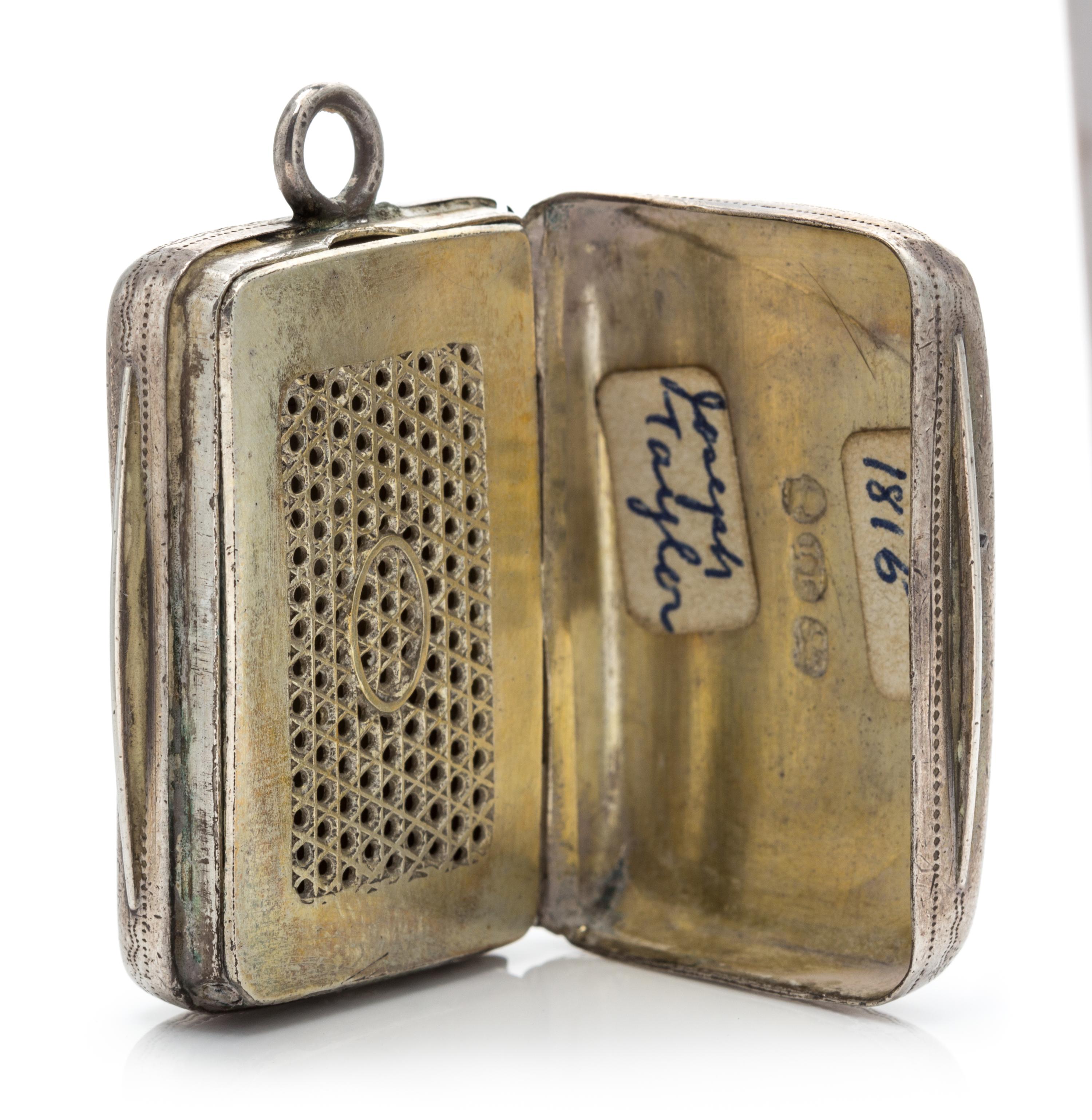 A George III Silver Vinaigrette, Joseph Taylor, Birmingham, 1814, the lid having foliate decoration and centered by a monogrammed carto