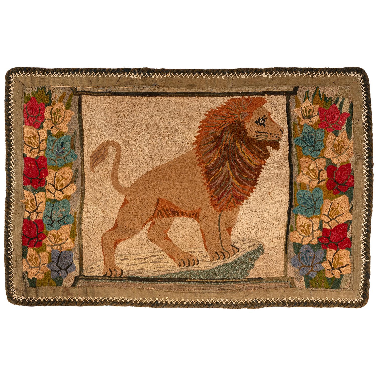 A Hooked Rug with a Lion and Floral Border