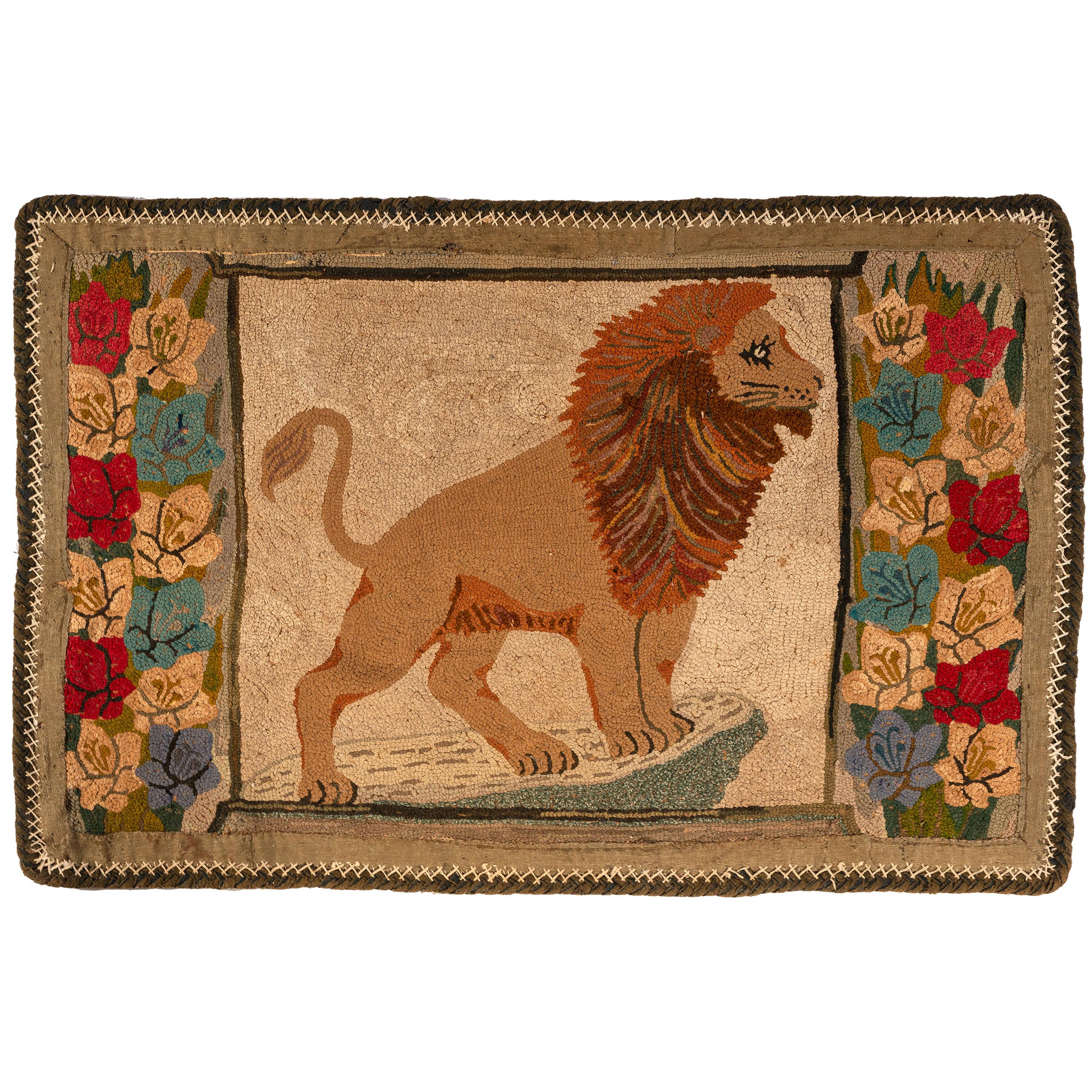 A Hooked Rug with a Lion and Floral Border