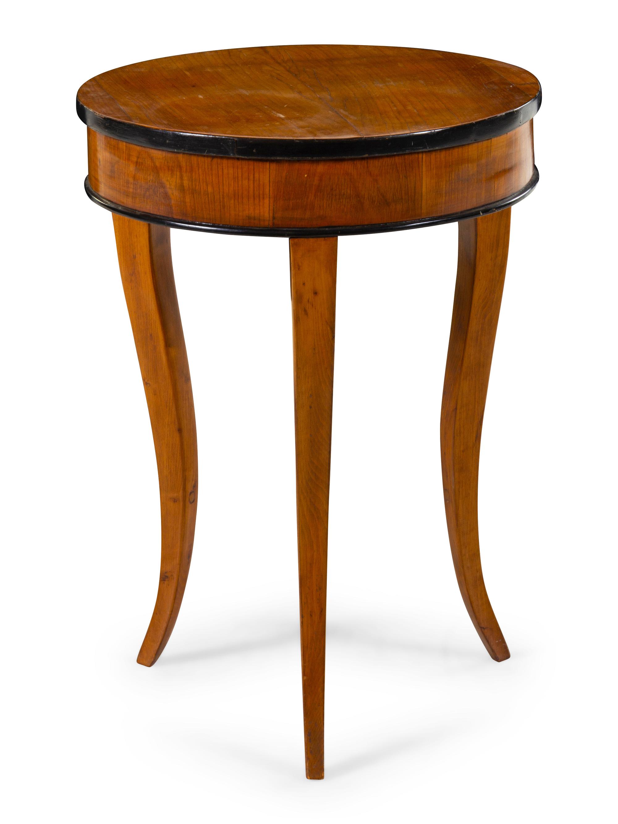 A Biedermeier Parcel Ebonized Occasional Table