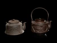 Seven Japanese Cast Iron Teapots, Tetsubin, and Burner