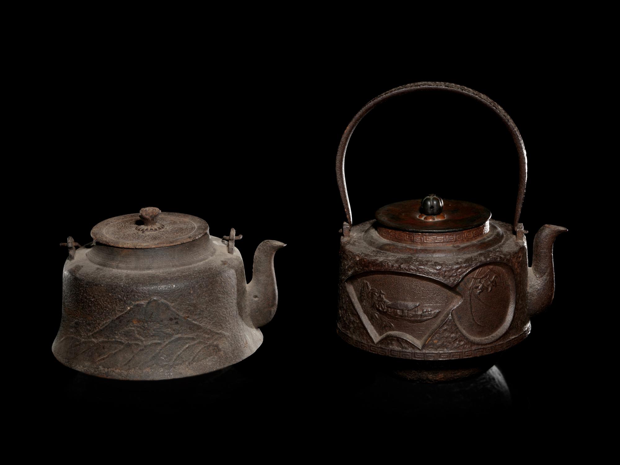 Seven Japanese Cast Iron Teapots, Tetsubin, and Burner