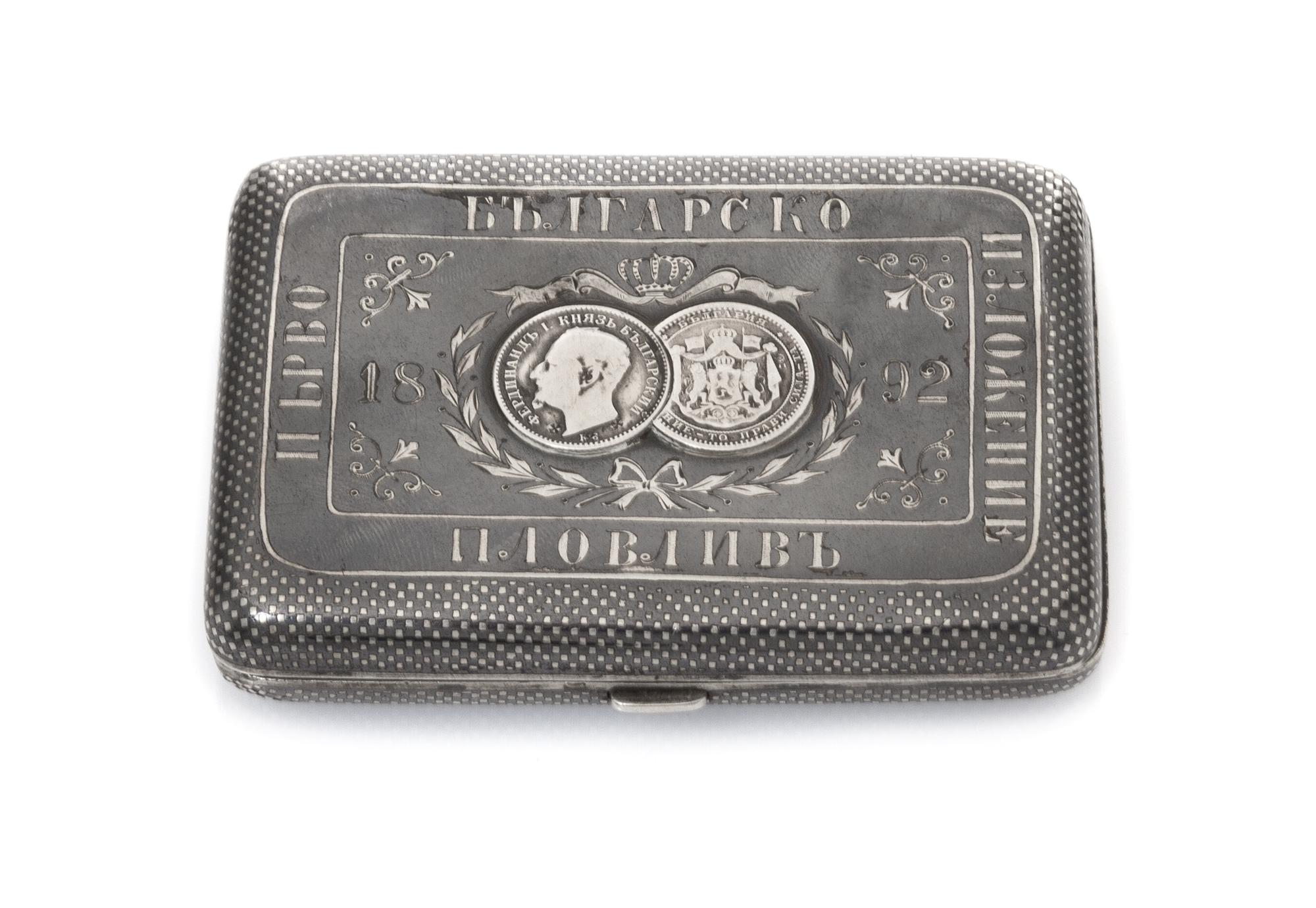 A Russian Niello Silver Cigarette Case, Late 19th century, the lid centered with two Bulgarian silver lev coins beneath a coronet, furt