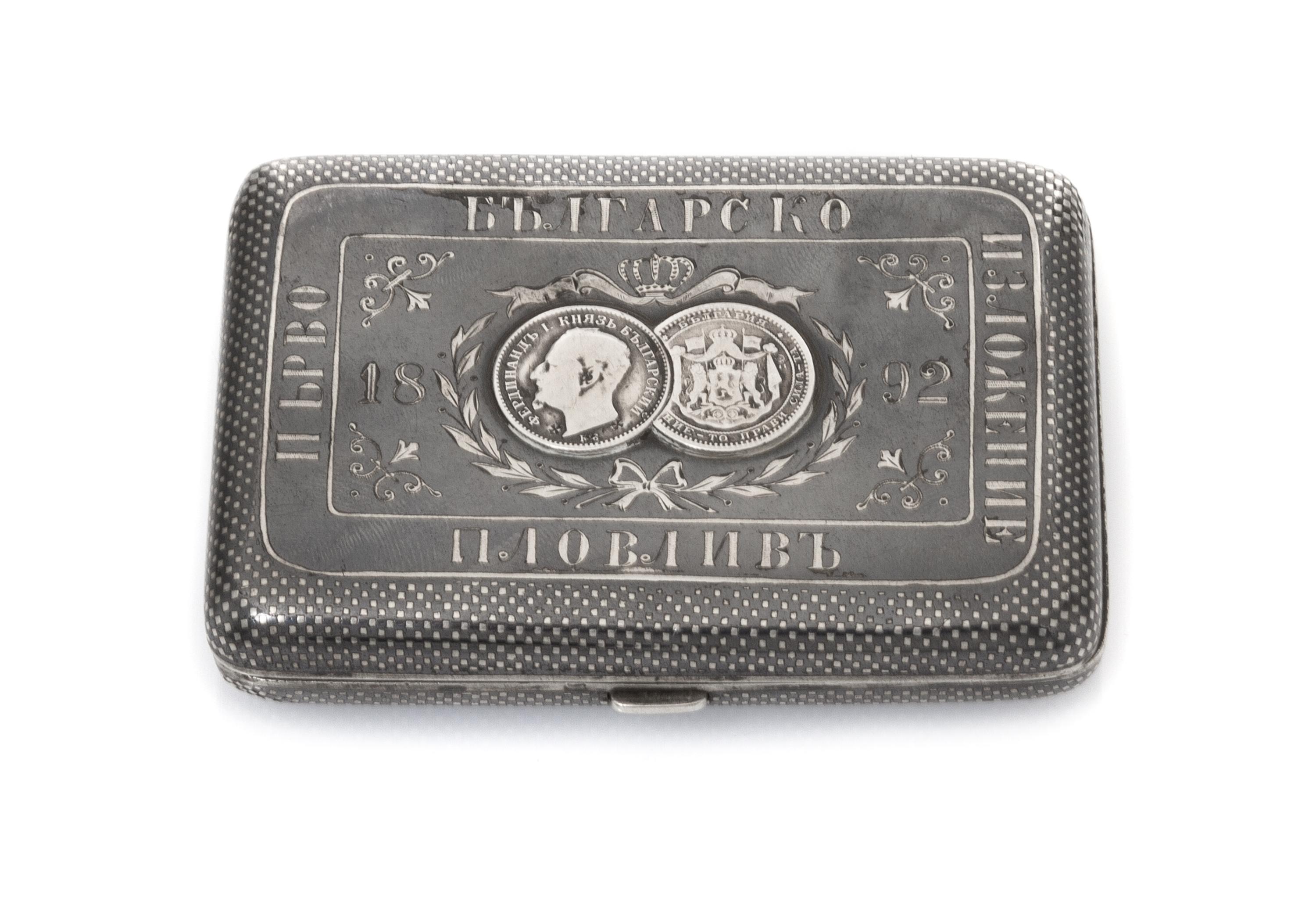 A Russian Niello Silver Cigarette Case, Late 19th century, the lid centered with two Bulgarian silver lev coins beneath a coronet, furt