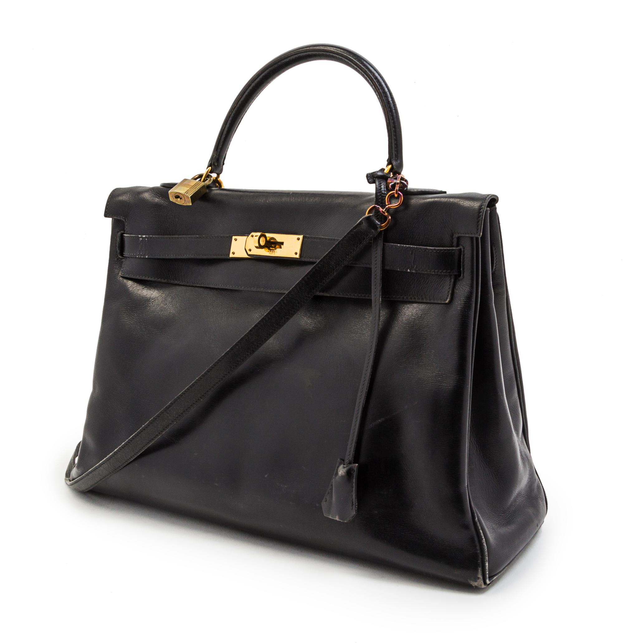 An Hermes 35cm Black Leather Kelly Bag, 14 x 8 x 7 inches.