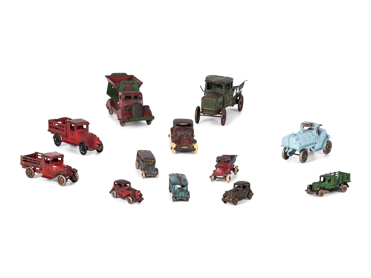 Twelve Painted Cast Iron Cars, Buses, and Trucks