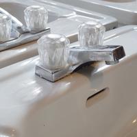 A Double-Sided Porcelain and Iron Six Basin Sink 41" W x 80" D x 31" H — United States, Circa 1930