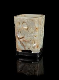 A Pale Celadon and Russet Jade Brushpot, Bitong Height 6 3/8 inches. — 19TH CENTURY
