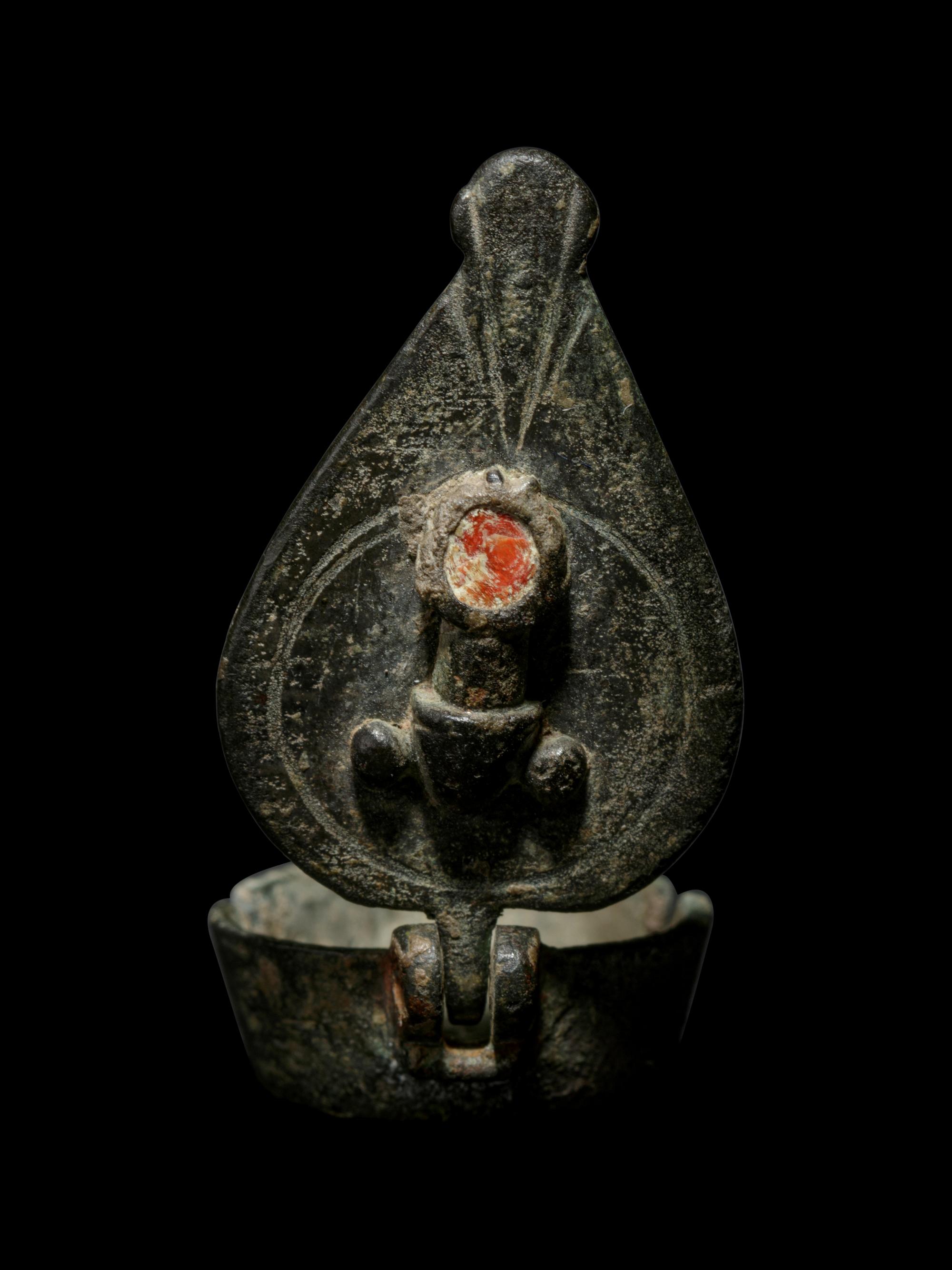 A Late Roman Bronze and Enamel Pendant with Phallic Symbols