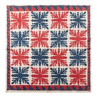 A Printed Red and Blue Cotton Applique and Pieced Quilt