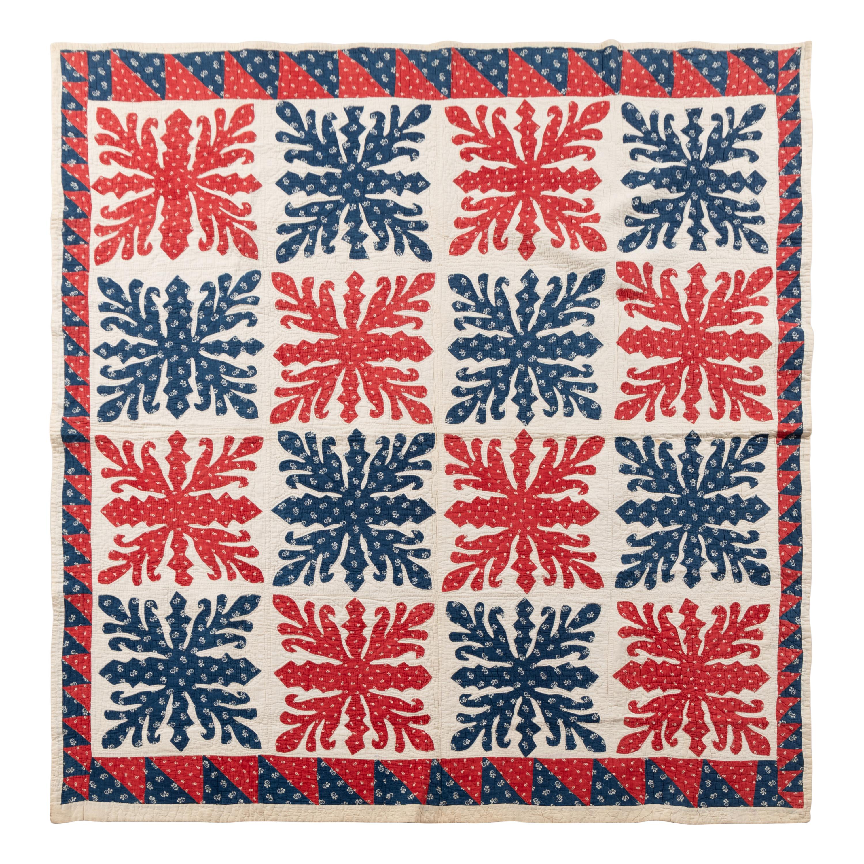 A Printed Red and Blue Cotton Applique and Pieced Quilt