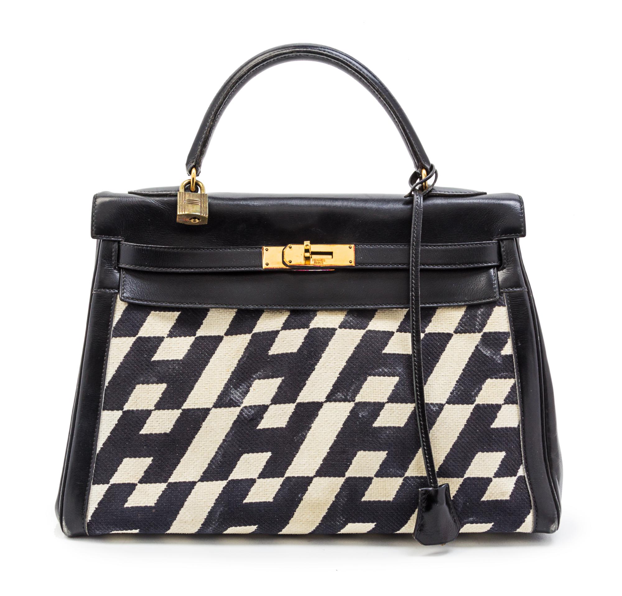 A Rare Hermes 35cm Ulysses Black Leather and Ivory Canvas Kelly Bag, 13 x 9 x 5 inches.