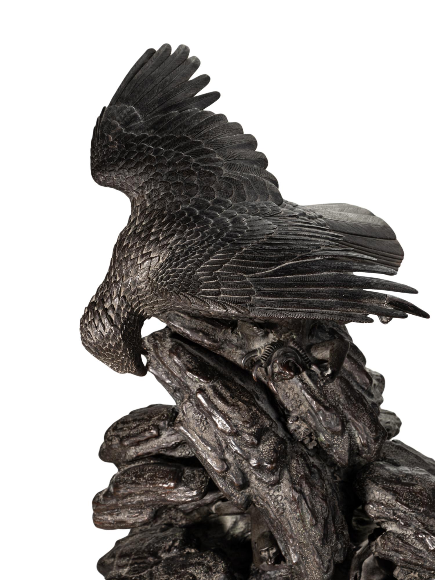 A Japanese Bronze Figural Group of a Hawk Hunting Monkeys