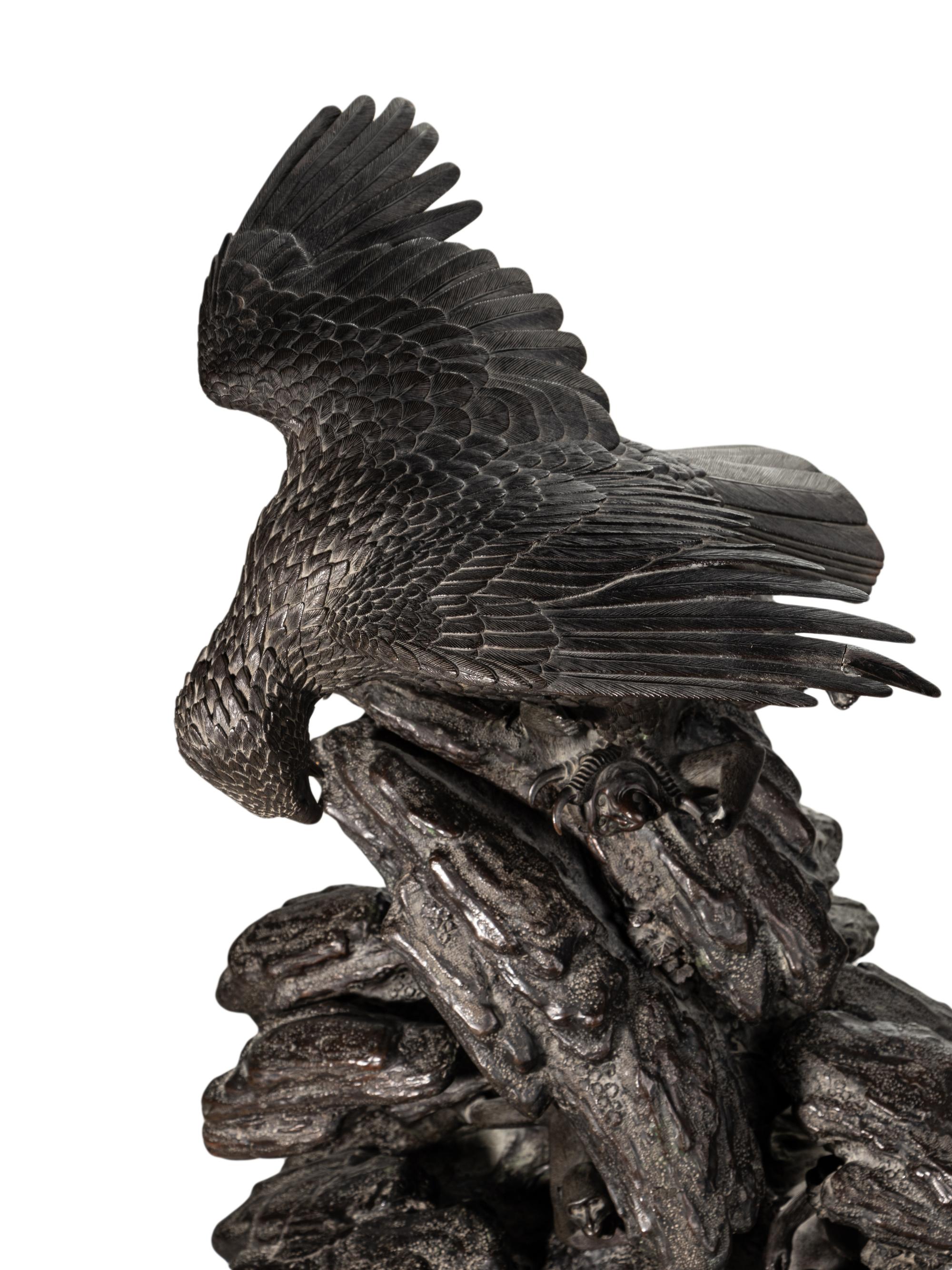 A Japanese Bronze Figural Group of a Hawk Hunting Monkeys