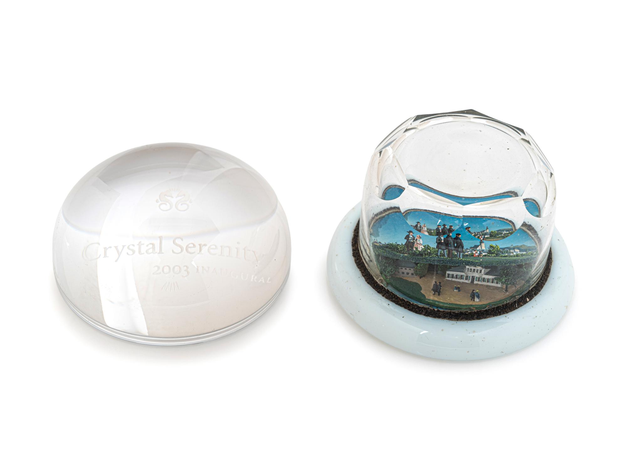 A Village Scene Diorama Faceted Glass Paperweight and a Commemorative Glass Paperweight