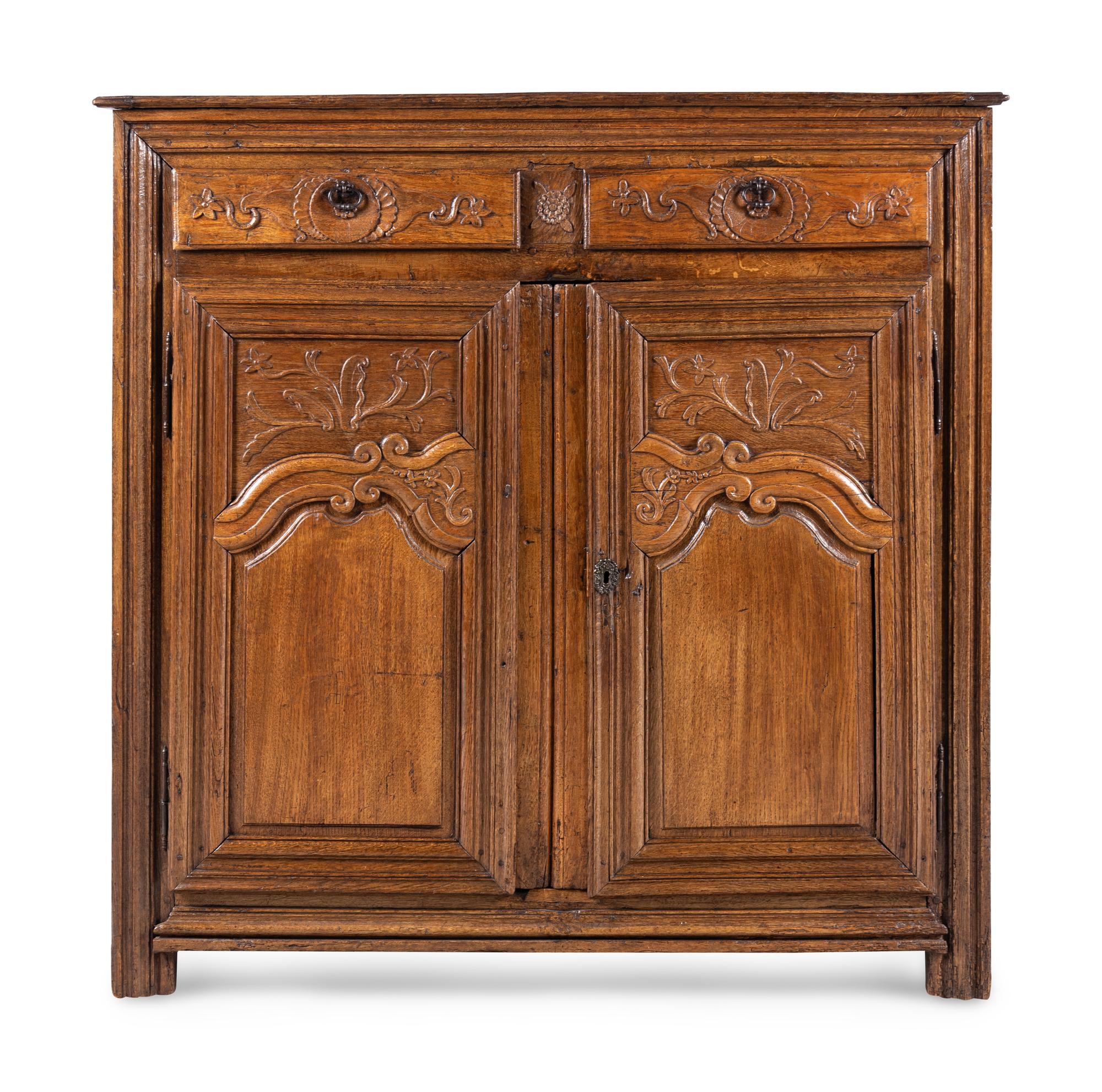 A French Provincial Carved Oak Cabinet