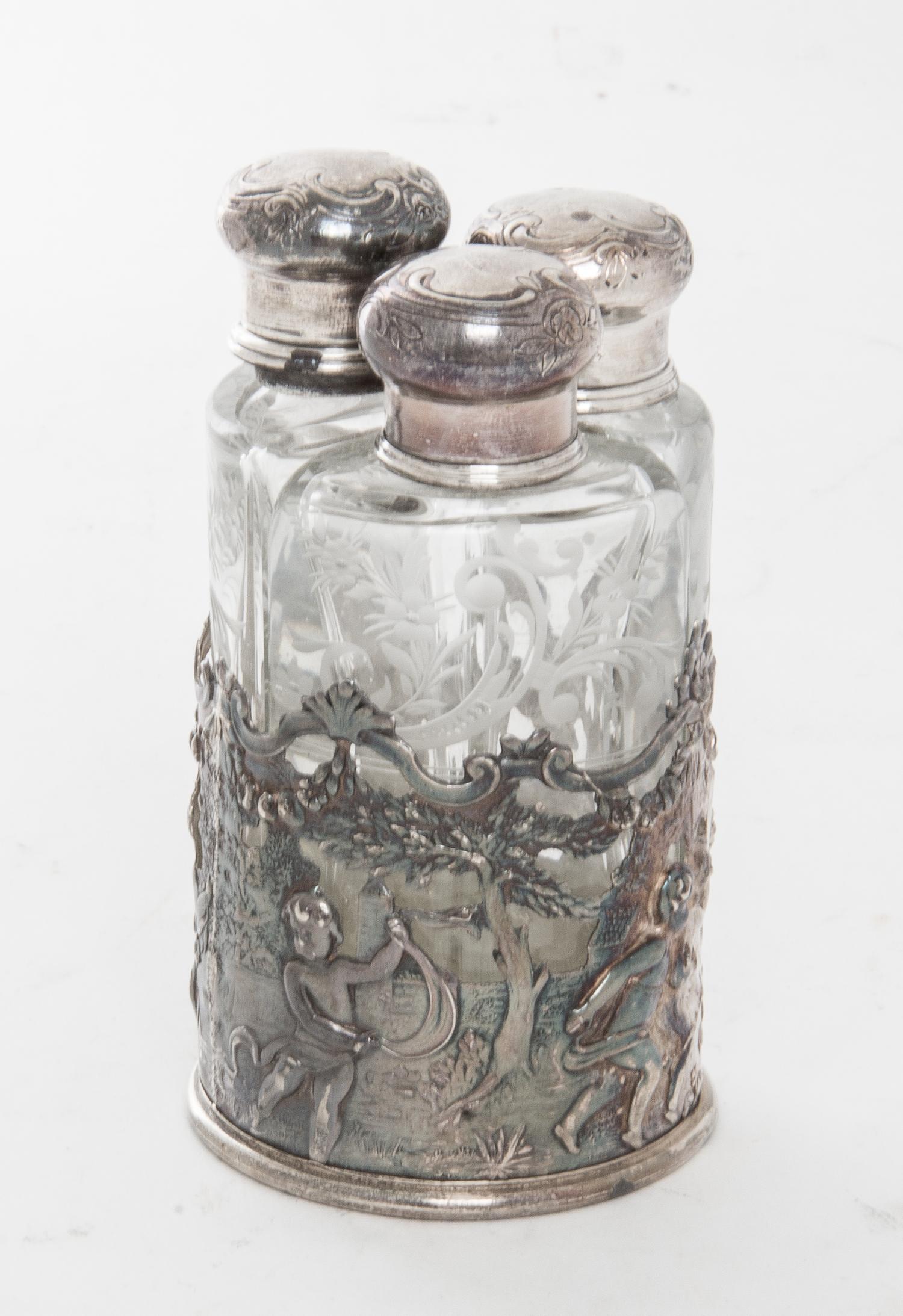 A German Silver and Glass Perfume Set Height 4 1/2 inches.