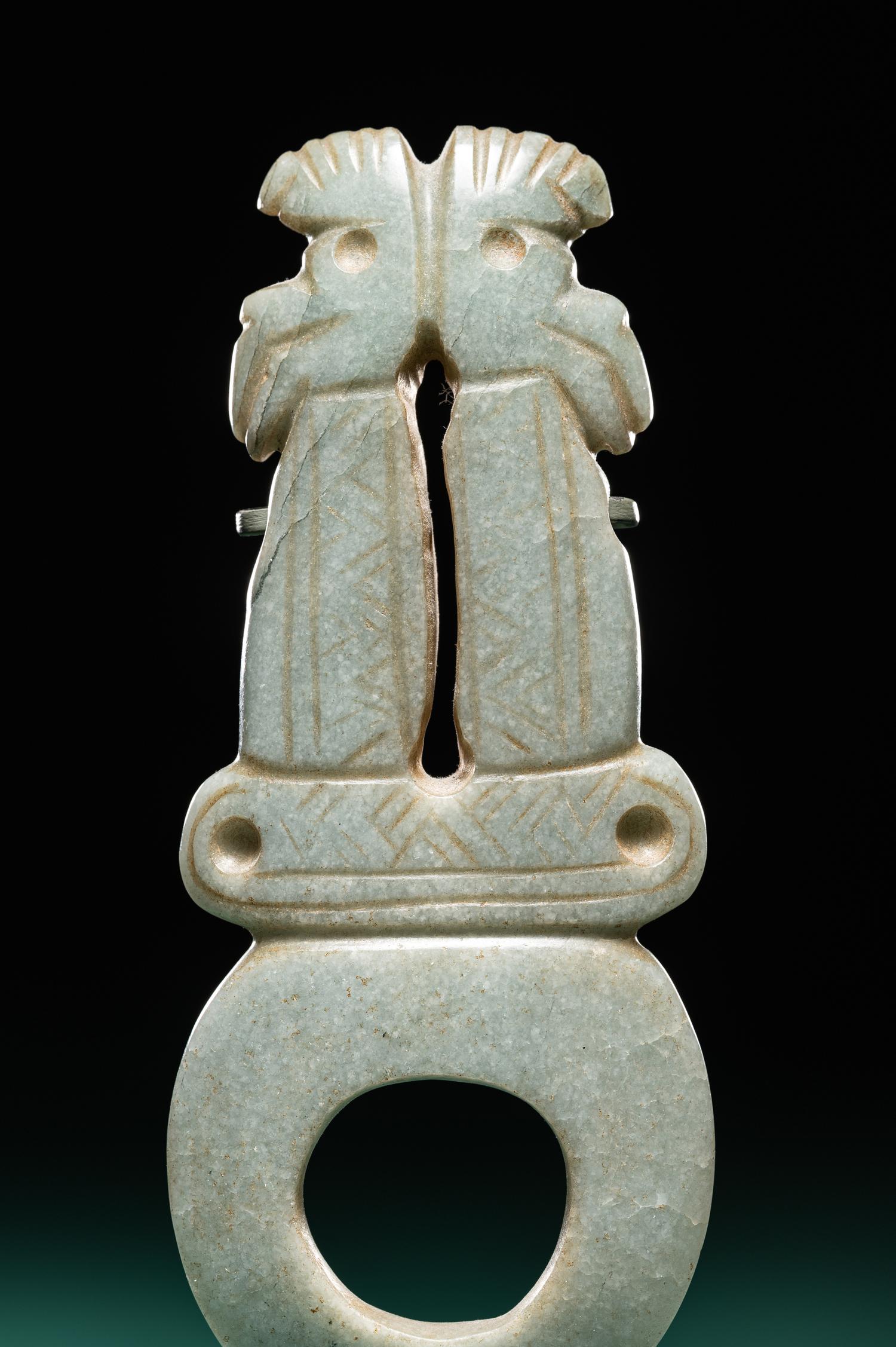 A Costa Rican Green Jade Double Avian Pendant