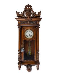 A Renaissance Revival Carved Walnut Regulator Clock