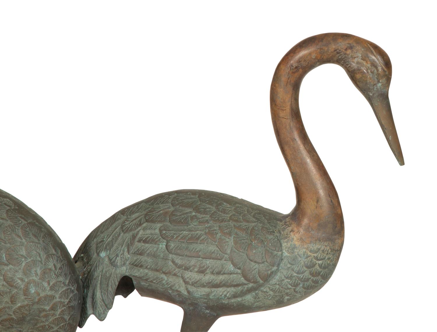A Bronze Sculpture of Four Standing Cranes