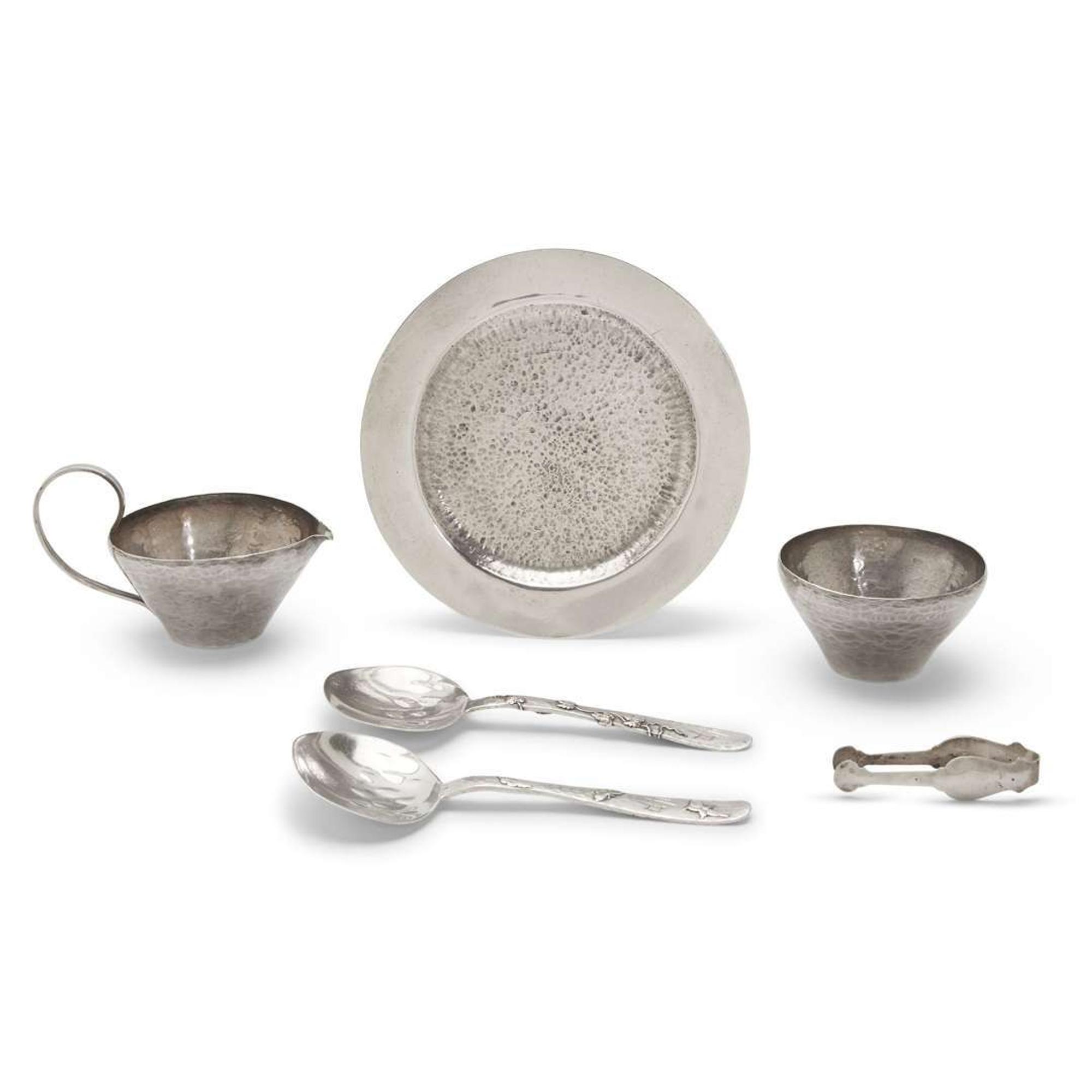 Pair of 'Lap-Over-Edge' Japanesque sterling silver serving spoons Tiffany & Co., New York, NY, circa 1880