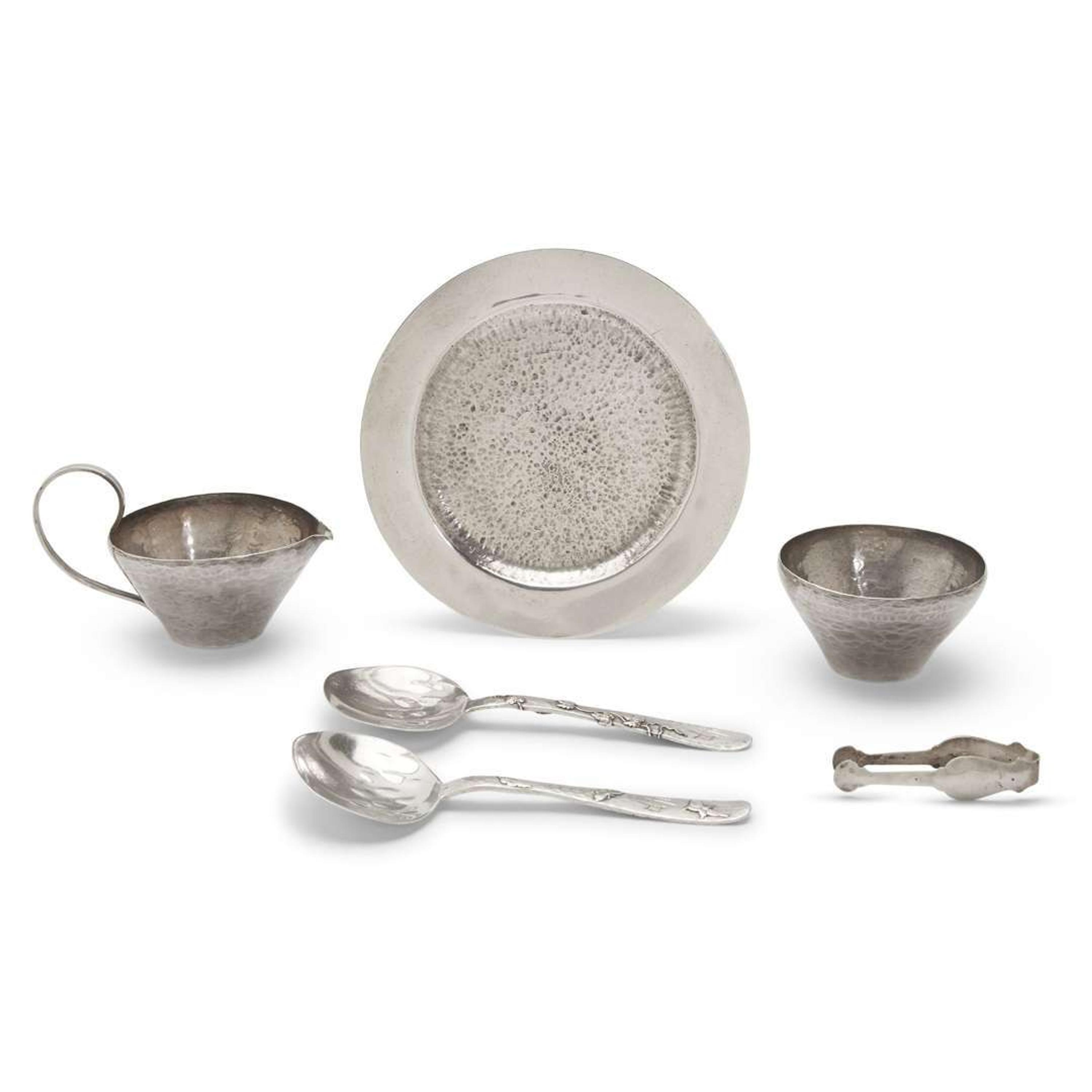 Pair of 'Lap-Over-Edge' Japanesque sterling silver serving spoons Tiffany & Co., New York, NY, circa 1880