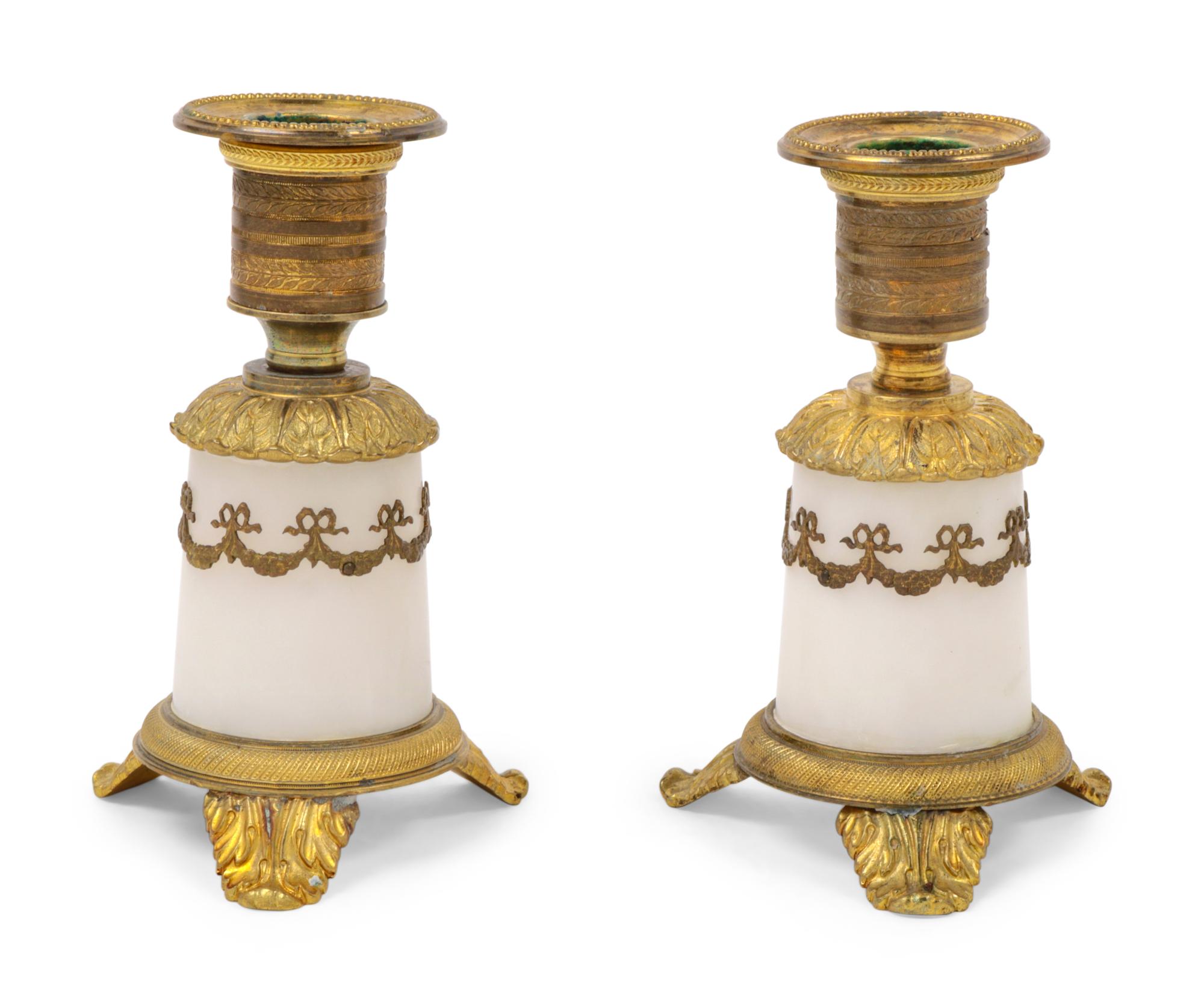A Pair of Empire Style Gilt Bronze Mounted Marble Candlesticks