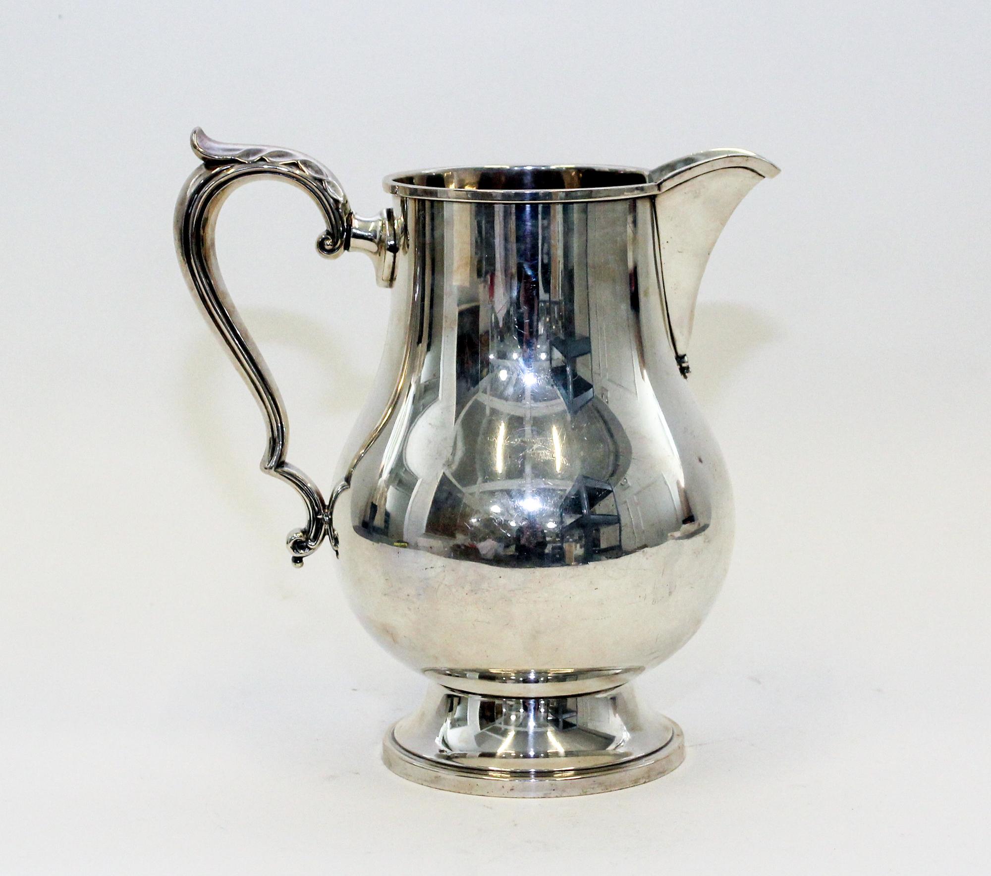 An American Silver Water Pitcher, M. Fred Hirsch Co., Jersey City, NJ, of baluster form, raised on a circular foot.